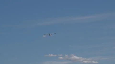 Small propeller airplane flying in the blue sky Stock Footage 252735366