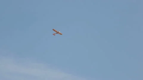 Small propeller airplane in the sky Stock Footage 104305844