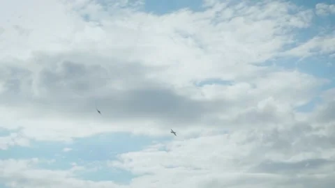 Small propeller airplanes flying in cloudy sky near airport perimeter fence Stock Footage 340394689