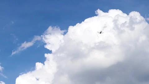 A small propeller-driven private plane flies in the sky with clouds. Stock Footage 155282471