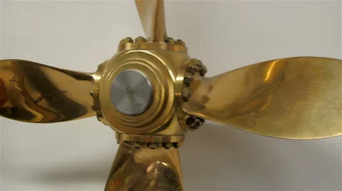 A small propeller in gold color Stock Footage 58608740