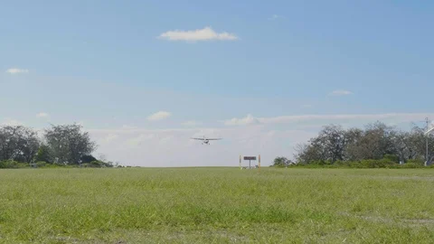 Small propeller plane landing - Lady Elliot Island Stock Footage 127045916