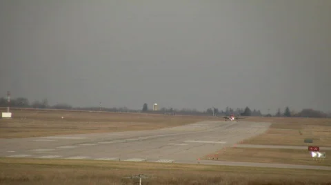 A small propeller plane lands at a regional airport (High Definition) Stock Footage 69233