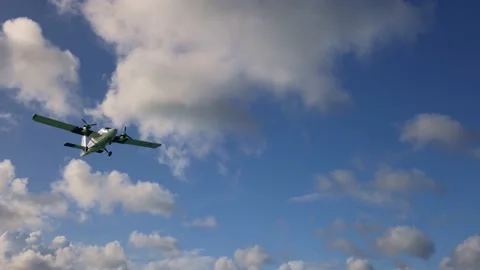 Small propeller plane in the sky, view from the land. Stock Footage 172163833