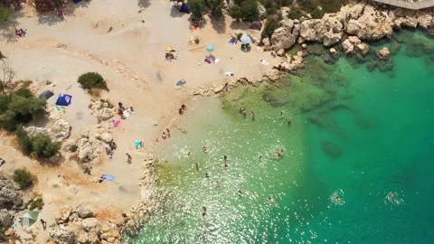 A small public beach in Kas, Turkey. Aerial view of cozy lagoon at mediterranean Stock Footage 220762671