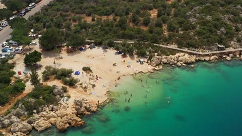A small public beach in Kas, Turkey. Aerial view of cozy lagoon at mediterranean Stock Footage 220762881