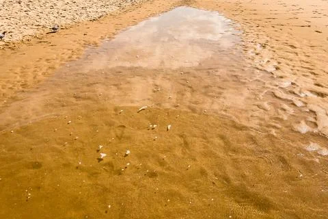 Small puddle on the coast Stock Photos