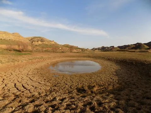 A small puddle in a semi-desert Stock Photos