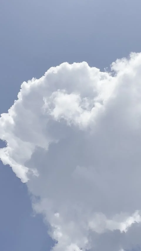 Small Puffy Cloud Formations in Blue Sky Stock Footage 345844963
