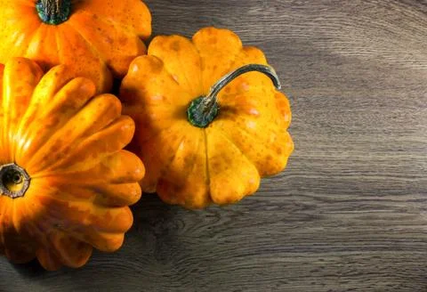 Small Pumpkins on a Wood Background Stock Photos