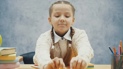 Small pupil is tear off one yellow sticker and stick it looking realy satisfied. Stock Footage 113072007