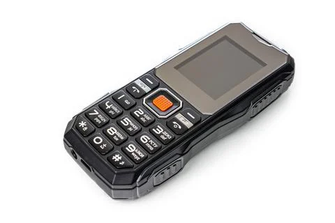 Small push-button cell phone on a white background. Obsolete model. Space f.. Stock Photos