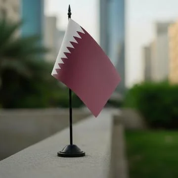 Small Qatari Flag on Stand in Urban Backdrop Stock Photos