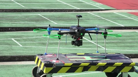 Small Quadcopter Drone Flying Around Lands On Platform 4K Stock Footage 45600219