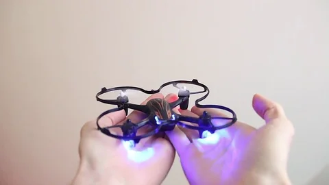 Small quadrocopter flies up from human hands Stock Footage 70308690