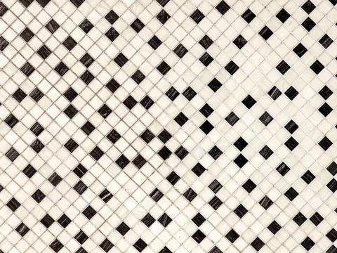 Small random black and white small ceramic tiles background, on diagonal. Stock Photos
