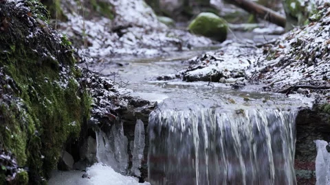 Small rapid river in winter. Melting water in spring. Stock Footage 220900333