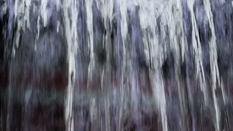 Small rapid river in winter. A small waterfall in Europea forest. Melting water Stock Footage 258642536