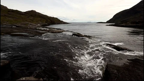 Small rapids of a river entering sea 스톡 동영상 102861883