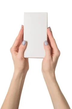 Small rectangular box in female hands. Top view. Isolate 스톡 사진