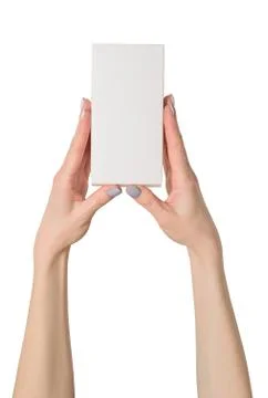 Small rectangular box in female hands. Top view. Isolate 스톡 사진
