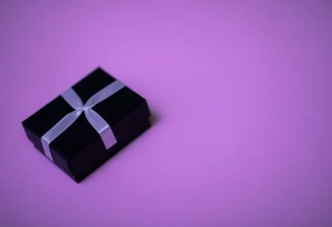 Small rectegular black gift box on colorful purple background Stock Photos