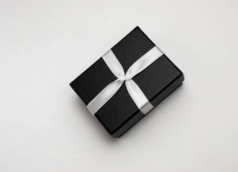 Small rectegular black gift box on a white background Stock Photos