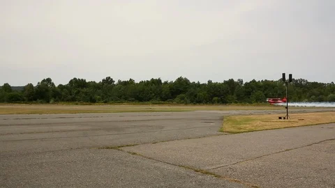 Small Red Aircraft Taking Off Stock Footage 99733505