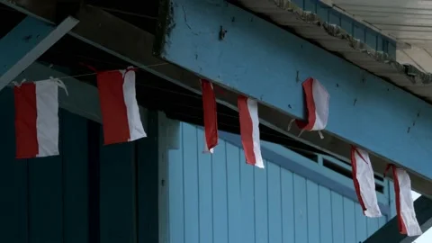 Small red and white pennants of Indonesia flag hanging as decoration Stock Footage 137075340