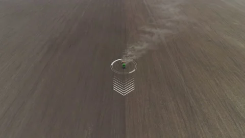 Small red autopilot tractor on anormous field plowing or seeding cereals Stock Footage 167557462