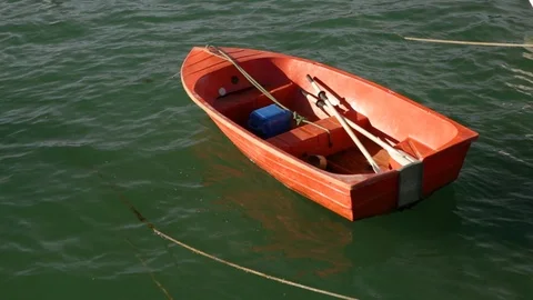 Small Red Boat On Water, Dinghy On Lake, Row Boat Anchored Stock Footage 106968264