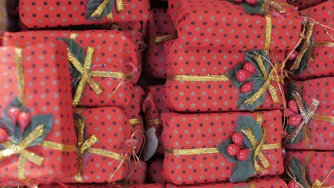 Small red dotted gift boxes, close-up. For decorating Christmas trees and gifts Stock Footage 305749251