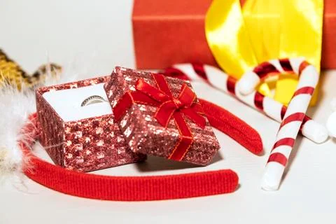 Small Red Gift Box with Deer Golden Glittering Horns, New Year concept Stock Photos