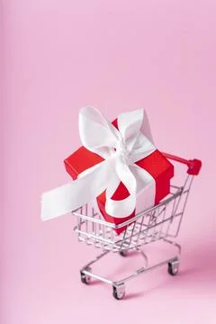 Small red gift box with white ribbon Stock Photos