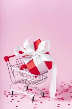 Small red gift box with white ribbon Stock Photos