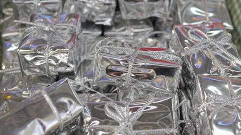 Small red gift boxes, close-up. For decorating Christmas trees and gifts. New Stock Footage 305749134