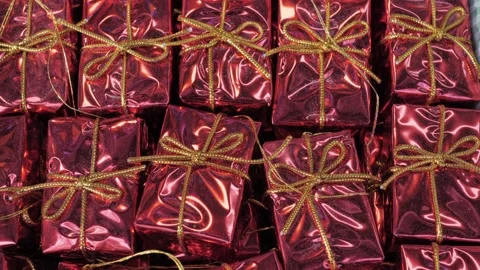 Small red gift boxes, close-up. For decorating Christmas trees and gifts. New Stock Footage 305751302