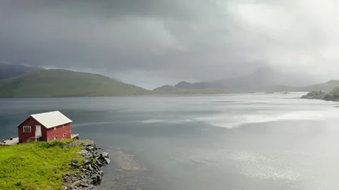 Small red house by the beach Stock Footage 255684228