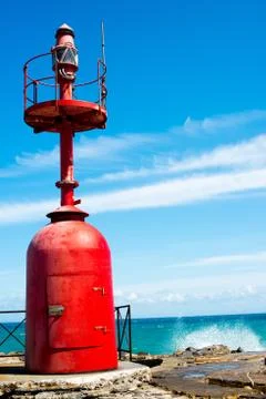 Small red lighthouse Stock Photos