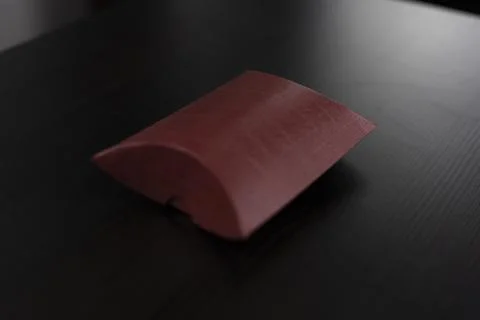 Small red packaging for small objects Stock Photos