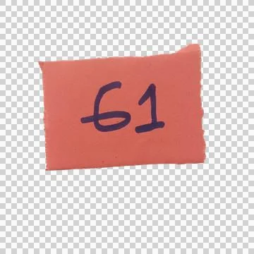 Small red paper note with the number sixty one written in dark blue ink Фото