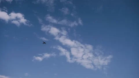 Small red plane flies over the blue sky. Flight lessons at Vadul lui Voda Stock Footage 136467348