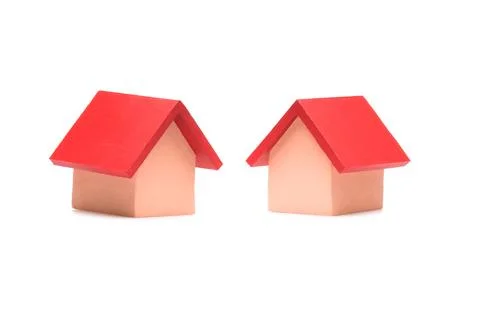 Small red roofed model house over white Фото