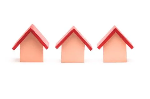 Small red roofed model house over white Фото