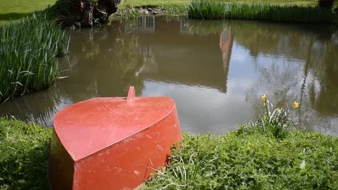 Small Red Rowing Boat by Lake Stock Footage 86705090