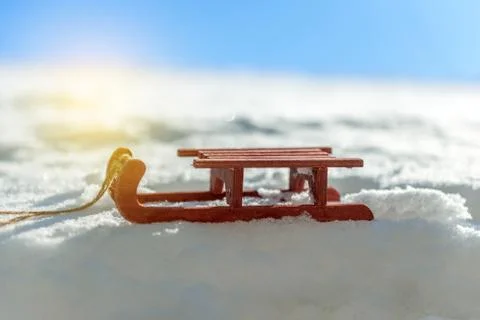 Small red sled in the snow Stock Photos