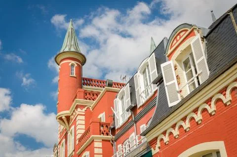 Small red tower on building with white shutters Stock Photos