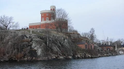Small red tower on an island, view from the water, near Stockholm, Sweden Stock Footage 60849090