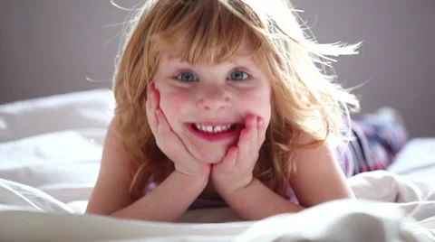 Small redhead girl posing against camera. Stock Footage 37335641