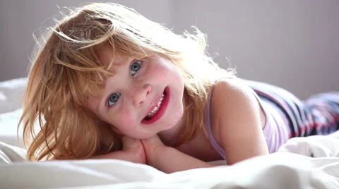 Small redhead girl posing against camera. Stock Footage 37335660